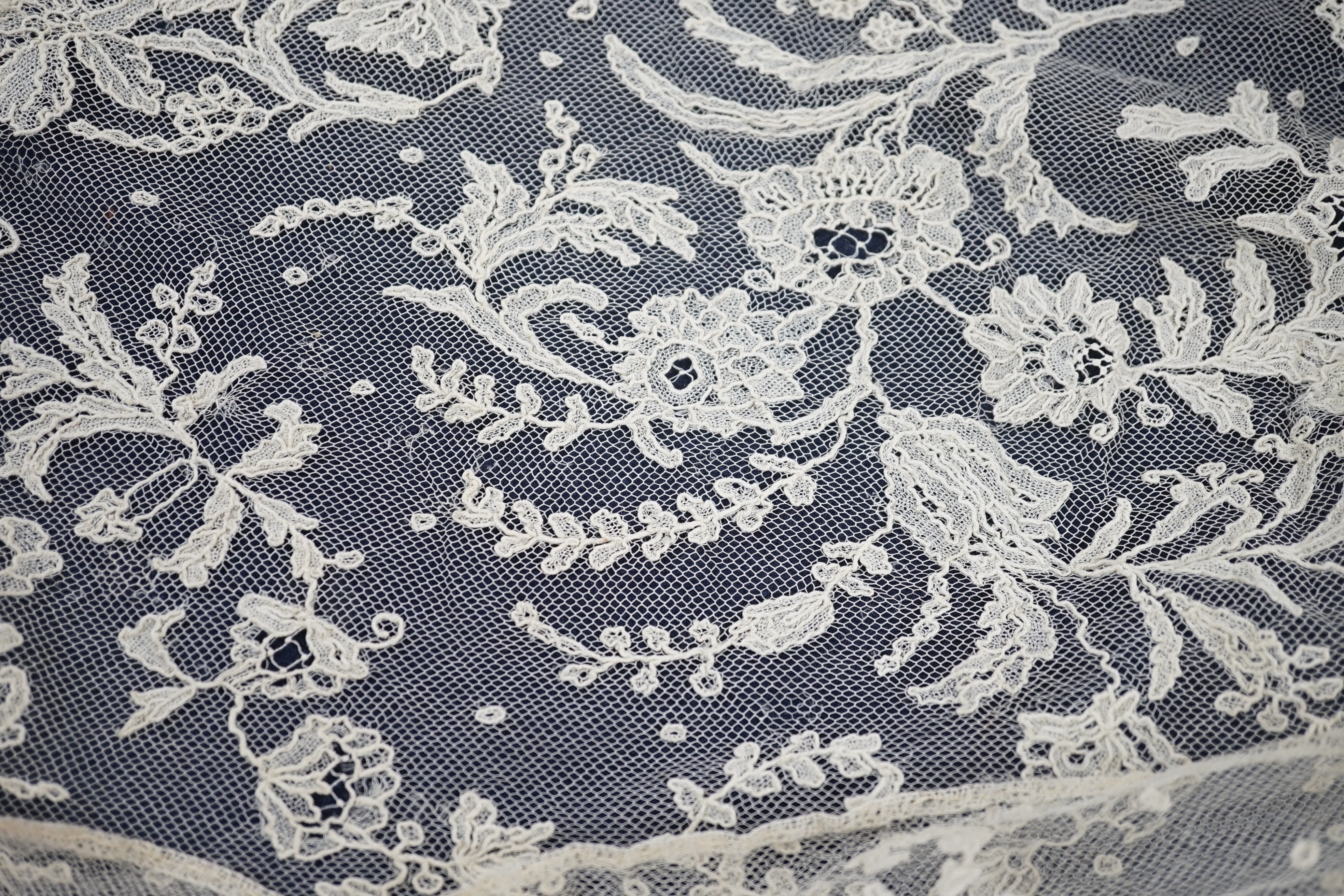 A rare length (9 and a half yards) of Brussels 19th century needle lace, some repairs and damage, circa 1880 and a similar wedding veil